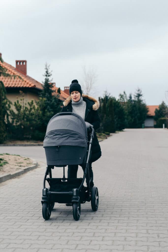 female pushing stroller